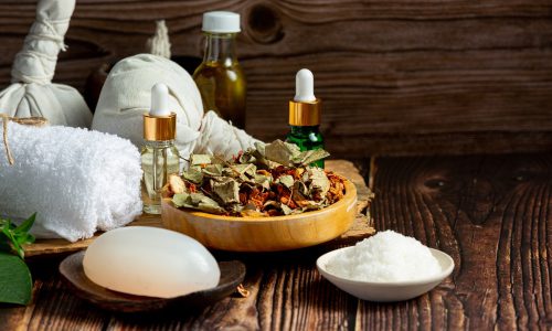 herbal spa treatment equipments put on wooden floor